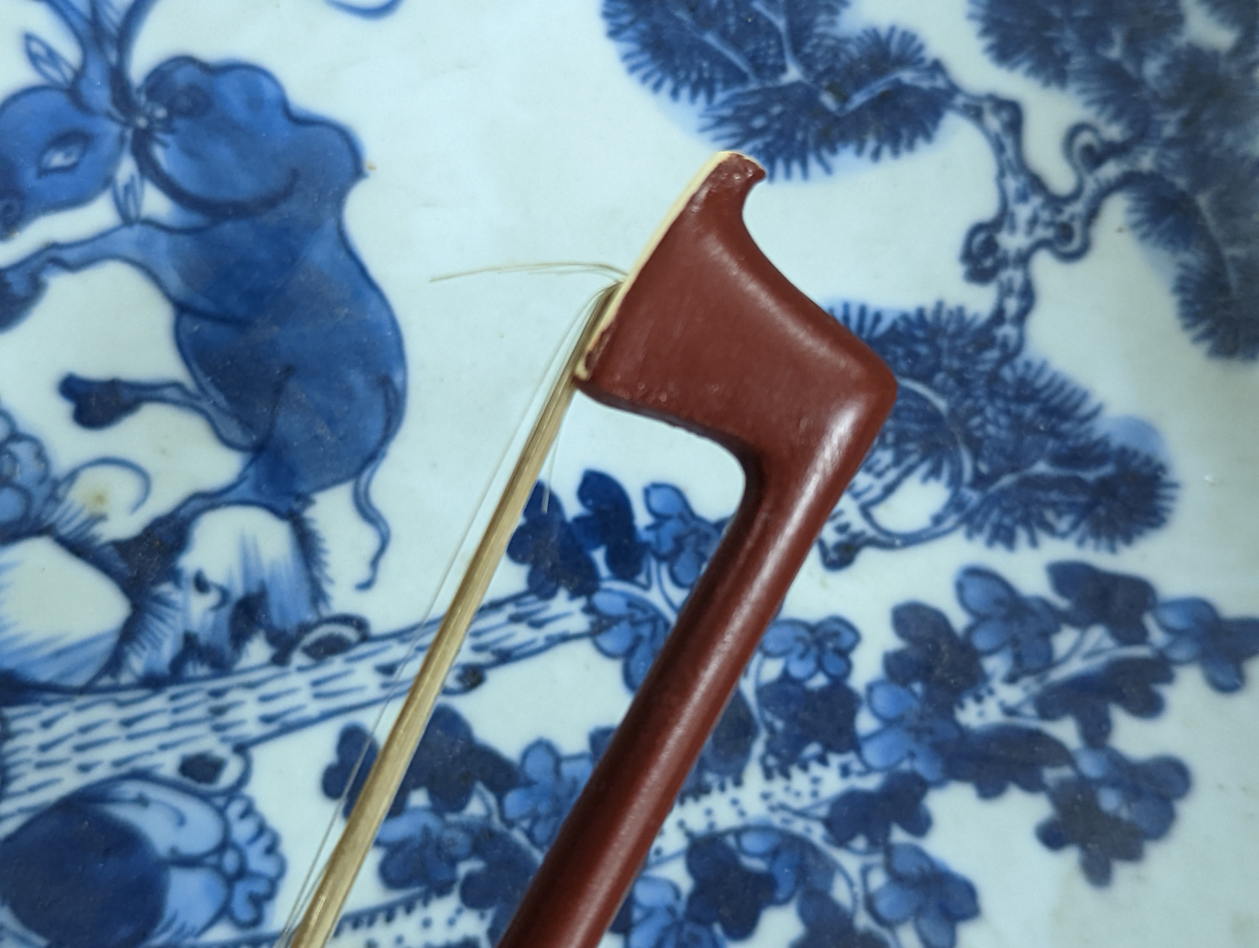 An early 20th century French vioilin, cased with bow and a cased saxon violin